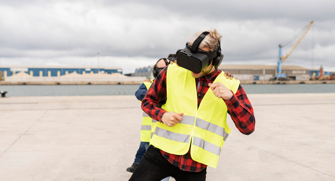 workers having fun with vr glasses