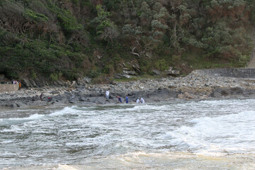 Church group doing baptism in the sea at Vic Bay, South Africa