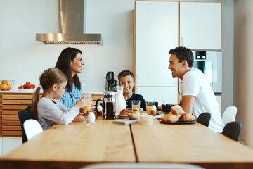 Family talking over breakfast