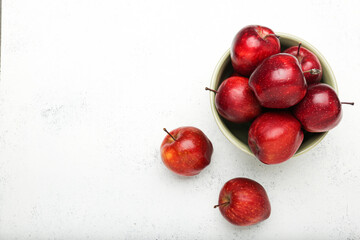 Fresh red apples. On a white stone background. Top view.
