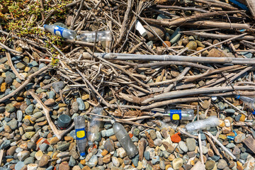 Garbage thrown by the sea accumulated on the shore