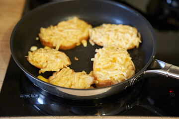 Delicious fried bread with an egg in a frying pan. Hot homemade sandwich step-by-step preparation