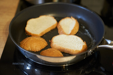 Delicious fried bread in a frying pan. Hot homemade sandwich step-by-step preparation