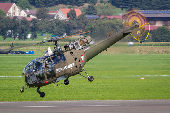 Austrian Air Force Alluette III helicopter departing for a rescue mission in the mountains