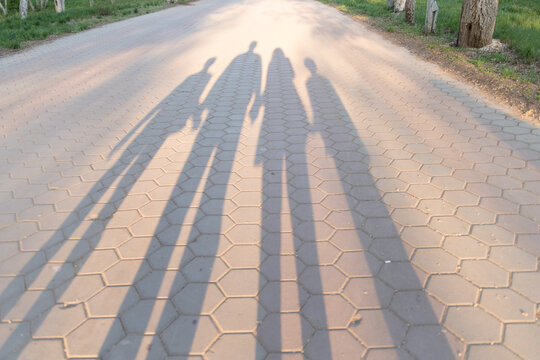 Relationship concept shadow silhouettes on the road