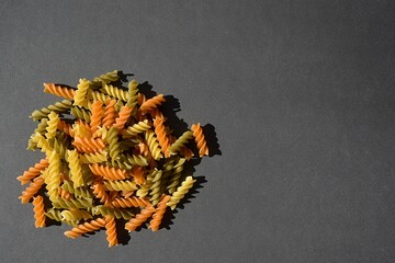 three colors of wheat pasta. Green from spinach,red from red pepper and plain-coloured simply from the wheat itself