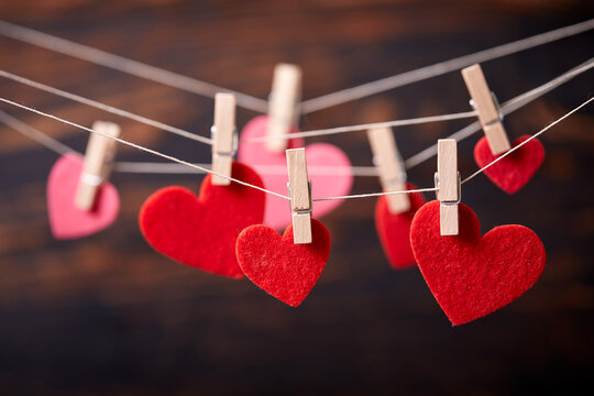 Red heart on wooden clothespin