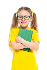 Cheerful young child girl with glasses holding a book to study isolated on a white background.