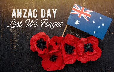 anzac day - Australian and New Zealand national public holiday, australian flag and poppy flowers memorial background