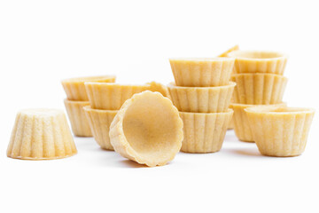 Stack of empty tartlets (tarts, tart shells) isolated on the white background