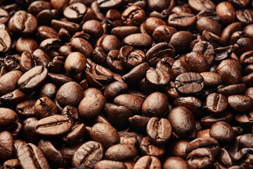 Texture of roasted ready to drink coffee. Close-up, selective focus. Scene of coffee beans. Black ground coffee