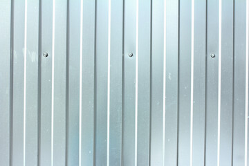 Gray corrugated steel fence, metal profiled sheet texture 