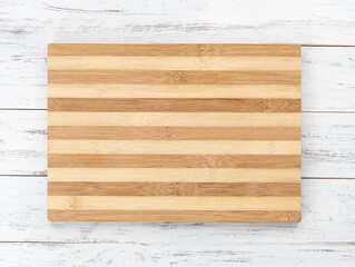 Empty wooden board over wooden table with copy space