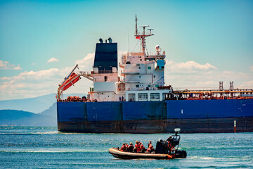 whale watchers and supertanker