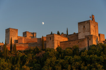 Fototapeta na wymiar Panoramic view of the Alhambra and the moon at sunset