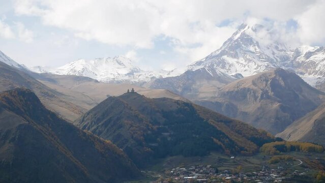 Mountain kazbek, Mkinvartsveri and town Stepantsminda, autumn colors of Georgia
