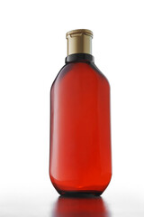 Brown plastic mockup bottle of shampoo, hair conditioner, washing gel on white background. No label advertisement template, copy space