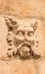 Medieval sculpture - creature head in Montblanc, Tarragona, Spain