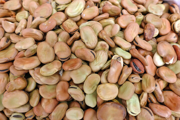 Unpackaged broad bean seeds, organic broad bean seeds, seed seller and ancestor seeds sold in cloth bags at seed shops,
