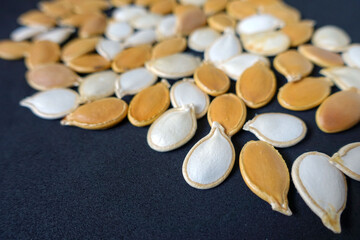 Fototapeta na wymiar ten slices of pumpkin seeds, pumpkin seeds organic ancestor seeds, close-up pumpkin seeds,