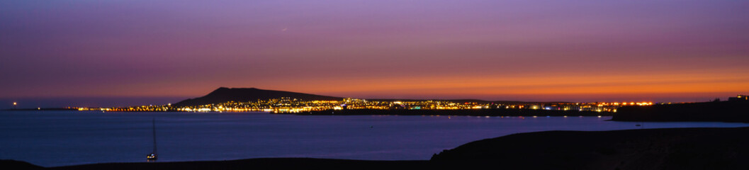 Panoramic view of the island of Fuerteventura from Papagayo beach (Lanzarote, Spain) at sunset