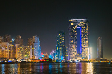 Fototapeta na wymiar Dubai Marina Port, UAE, United Arab Emirates - Night view of high-rise buildings of residential district in Dubai Marina.
