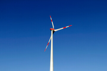 wind turbine in front of blue sky