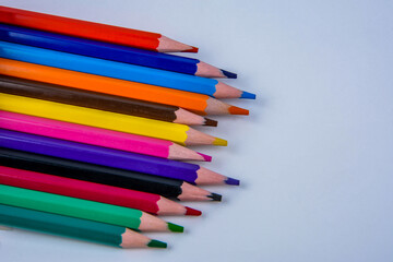 colored pencils of rainbow colors .Many colored pencils.