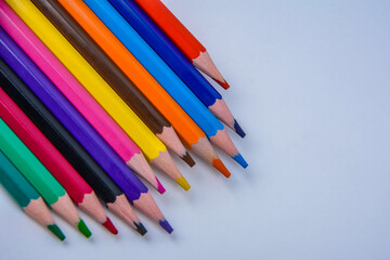 colored pencils of rainbow colors .Many colored pencils.