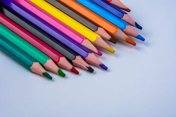 colored pencils of rainbow colors .Many colored pencils.