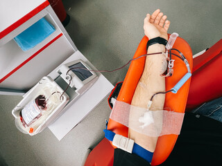 blood donation process from a donor at a blood transfusion center in Vinnytsia, Ukraine. Blood for...