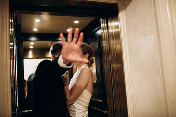 man gesturing ban on photography