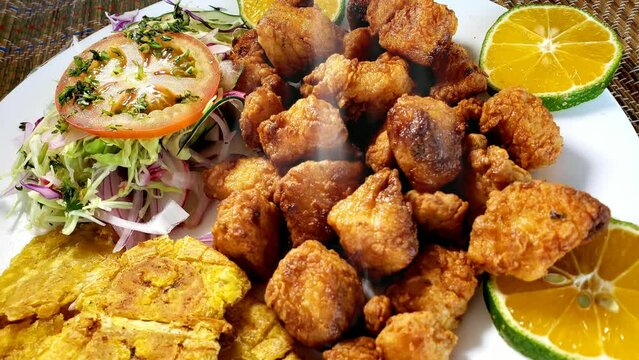 Steaming hot deep fried fish in 4k video