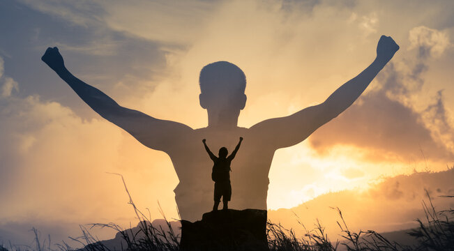 Young confident man on a mountain top facing the sunrise. Strength and inspiration concept. Double exposure 