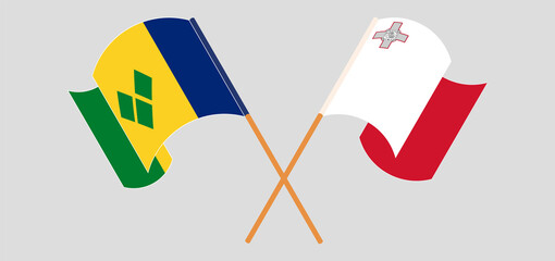 Crossed flags of Malta and Saint Vincent and the Grenadines. Official colors. Correct proportion