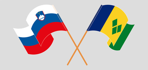 Crossed flags of Slovenia and Saint Vincent and the Grenadines. Official colors. Correct proportion
