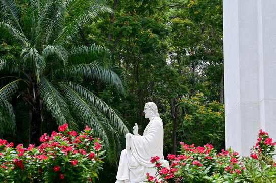 SAMUTPRAKAN, THAILAND - April 21, 2022 : Statue of Jesus Christ "JESU MAGISTER" located in front of The Chapel of St. Louis Marie de Montfort at Assumption University, Suvarnabhumi Campus, Thailand.