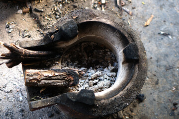 stove uses wood as fuel for cooking.