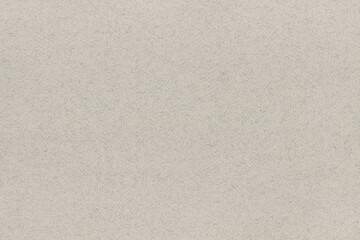 Texture of modern art light paper. Recyclable material with fluffy fragments, stubble, nap. Background for design