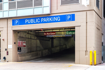 Urban parking sign and entrance