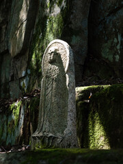 Stone Buddhist statue on a mountain path leading to Fukuoji temple - Hiroshima prefecture, Japan