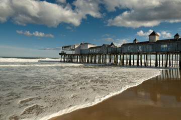 An old wooden pier with colorful cafes on the shores of the Atlantic Ocean. USA. Portland. old...