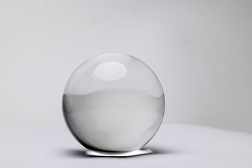 Clear glass transparent crystal lens ball on white background