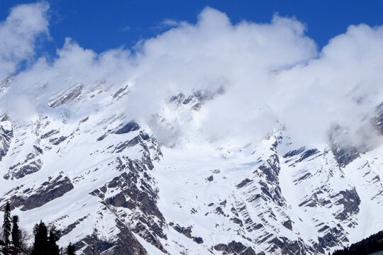 Cloudy snow mountains peak