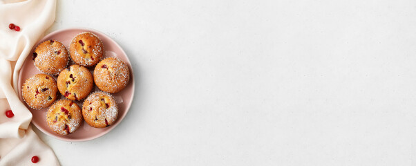 Plate with delicious cranberry muffins on white background with space for text