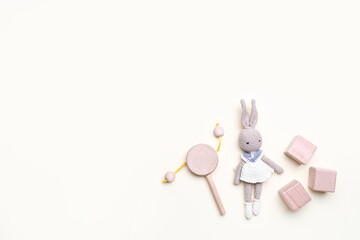 Wooden cubes with baby toys on white background