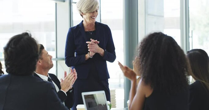 Excellence never goes unrecognized. 4k video footage of businesspeople applauding during a presentation in an office.