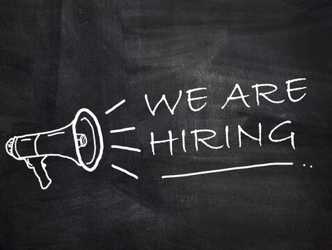 We are hiring text with megaphone on chalkboard background.
