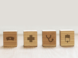 Wooden cubes with health icon.medicine and health insurance concepts.