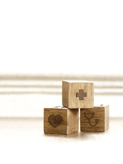 Wooden cubes with health icon.medicine and health insurance concepts.